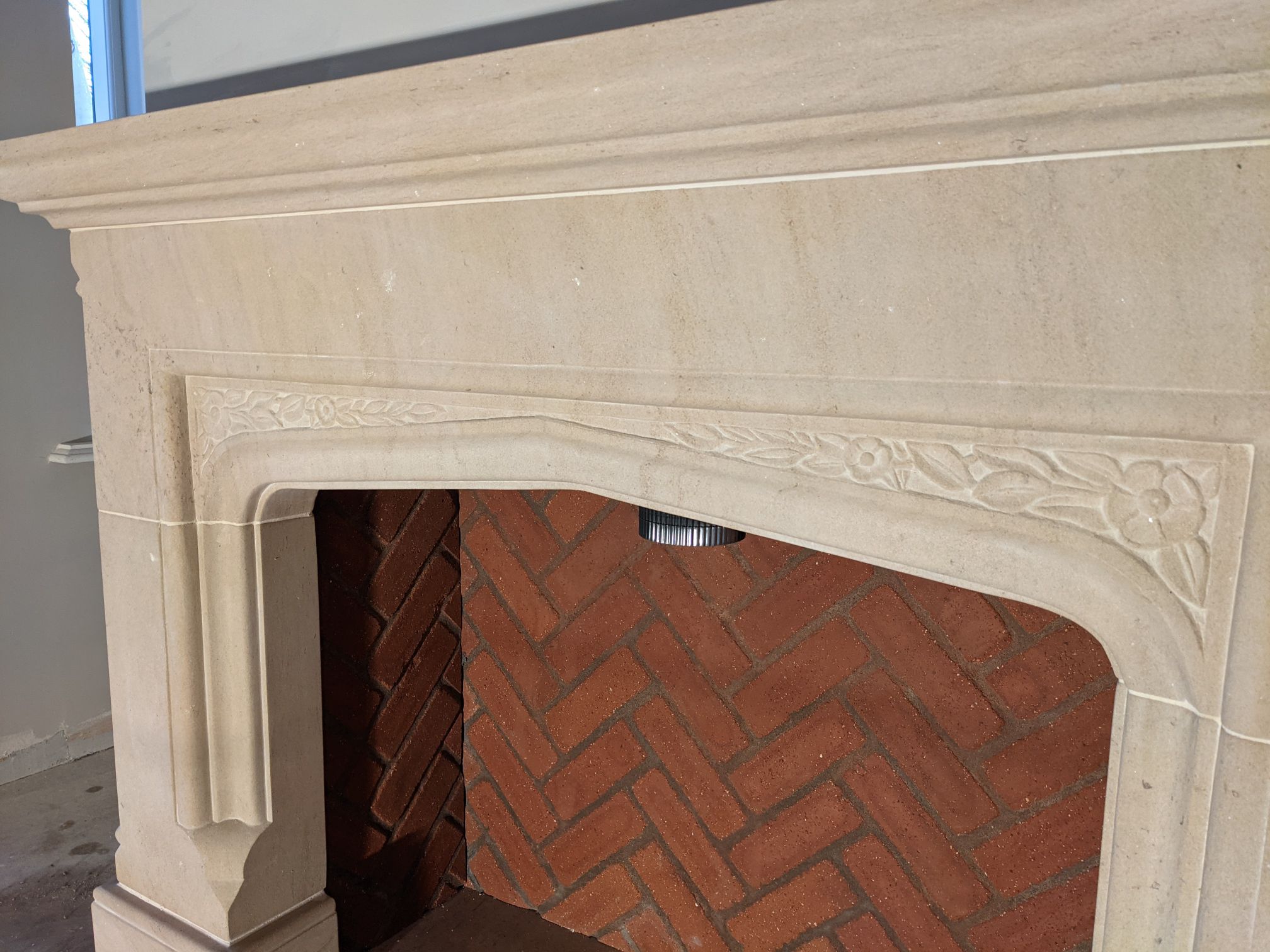 Carved limestone fire surround